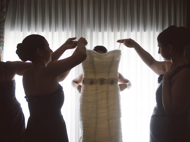 Putting on the wedding dress